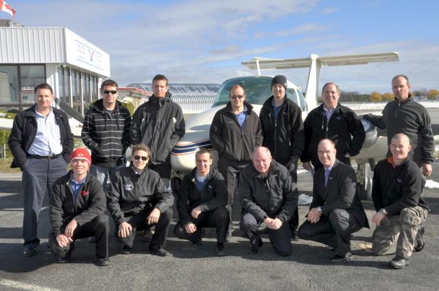 Movember's Team OFC captained by Jeff Davey: On November 1, 13 of the 33 Team OFC gather clean shaven in front of DMO for a group shot